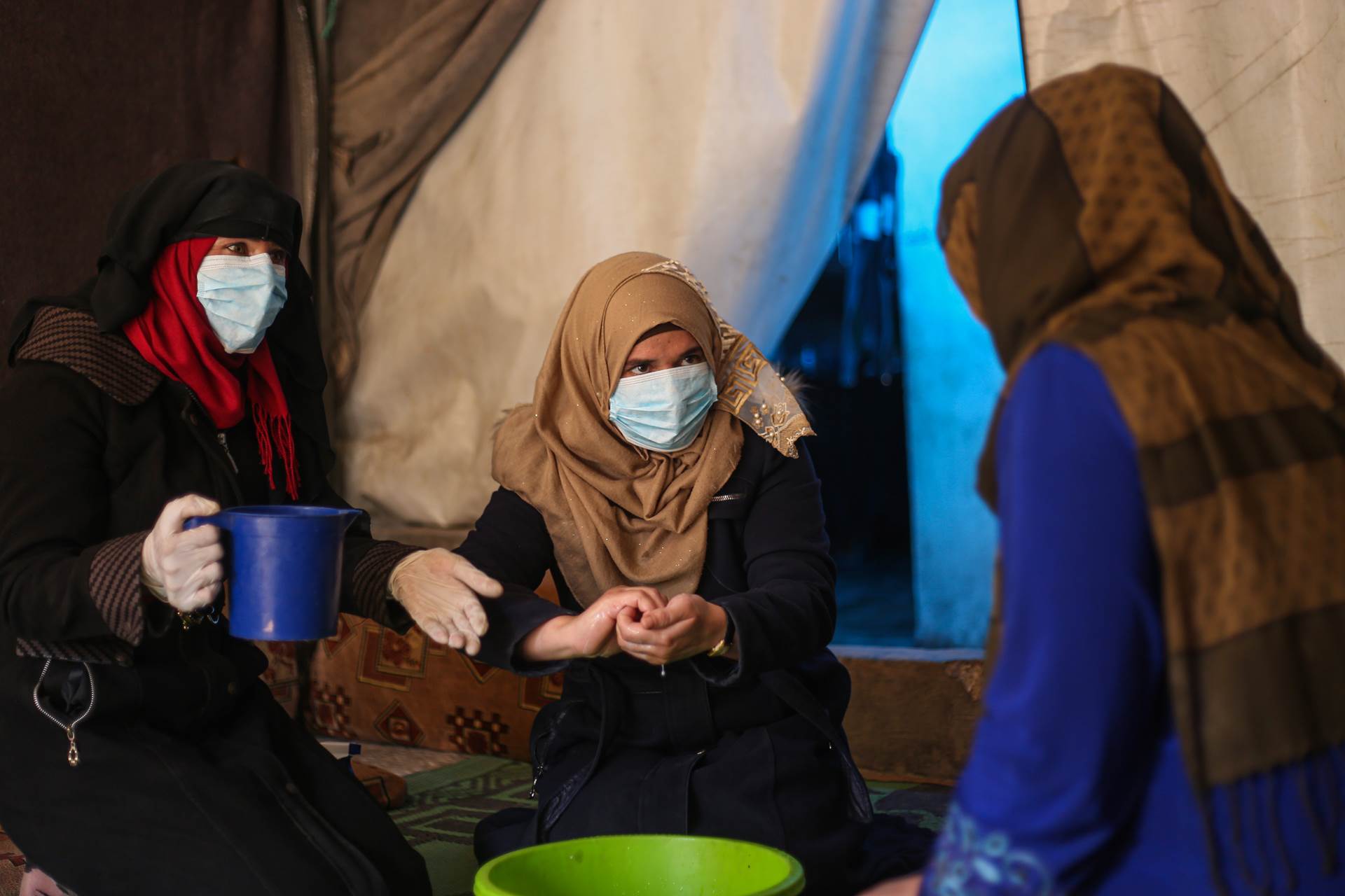 Eutur Nafra (left) is one of a number of women, working to raise community awareness regarding COVID-19 at the Abnaa Mhin IDP camp in northern Idleb Governorate. Displaced from Homs herself, she knows all too well the challenges of staying safe at this time. - mynd